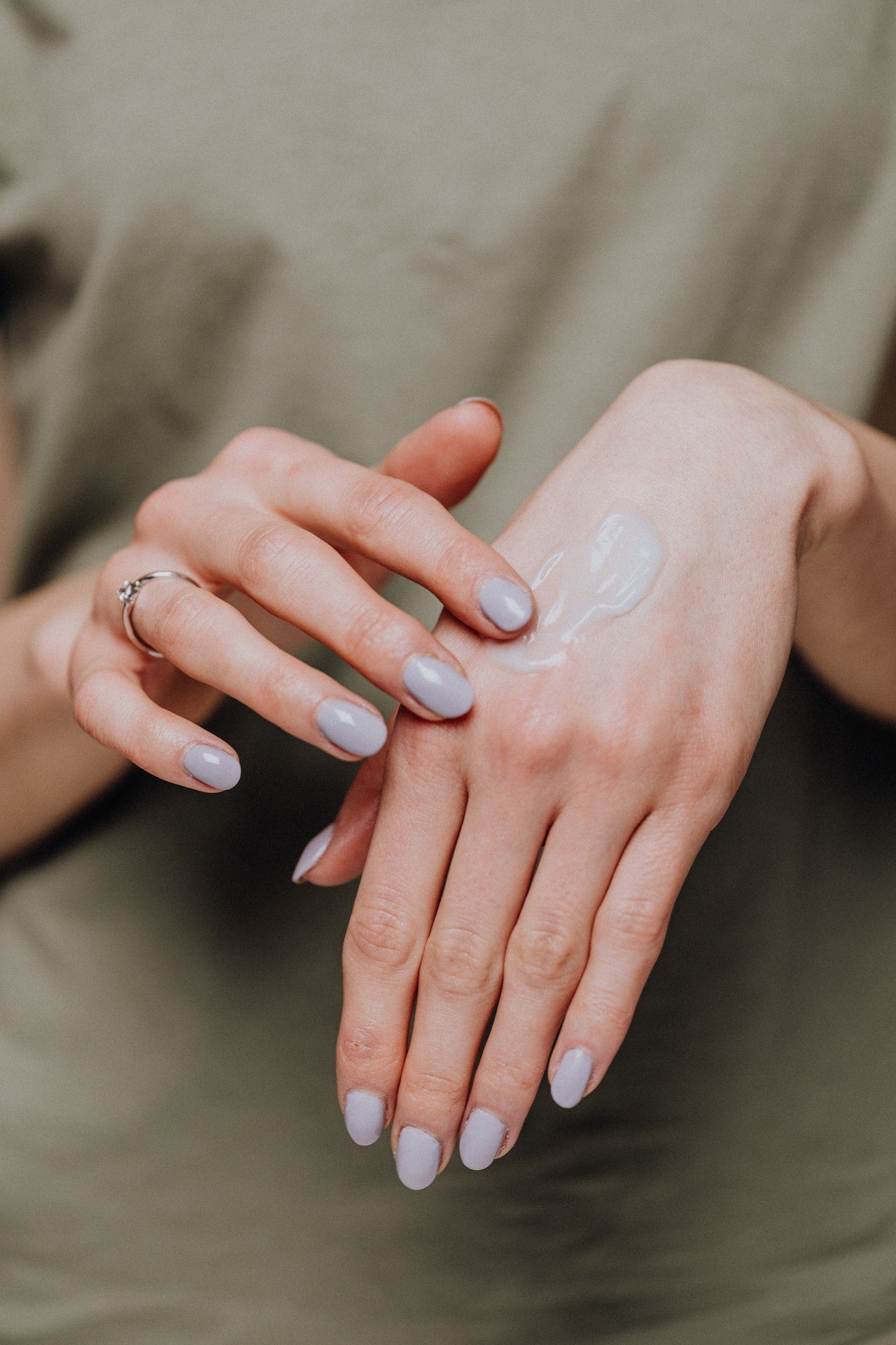 A woman applying CBD body butter